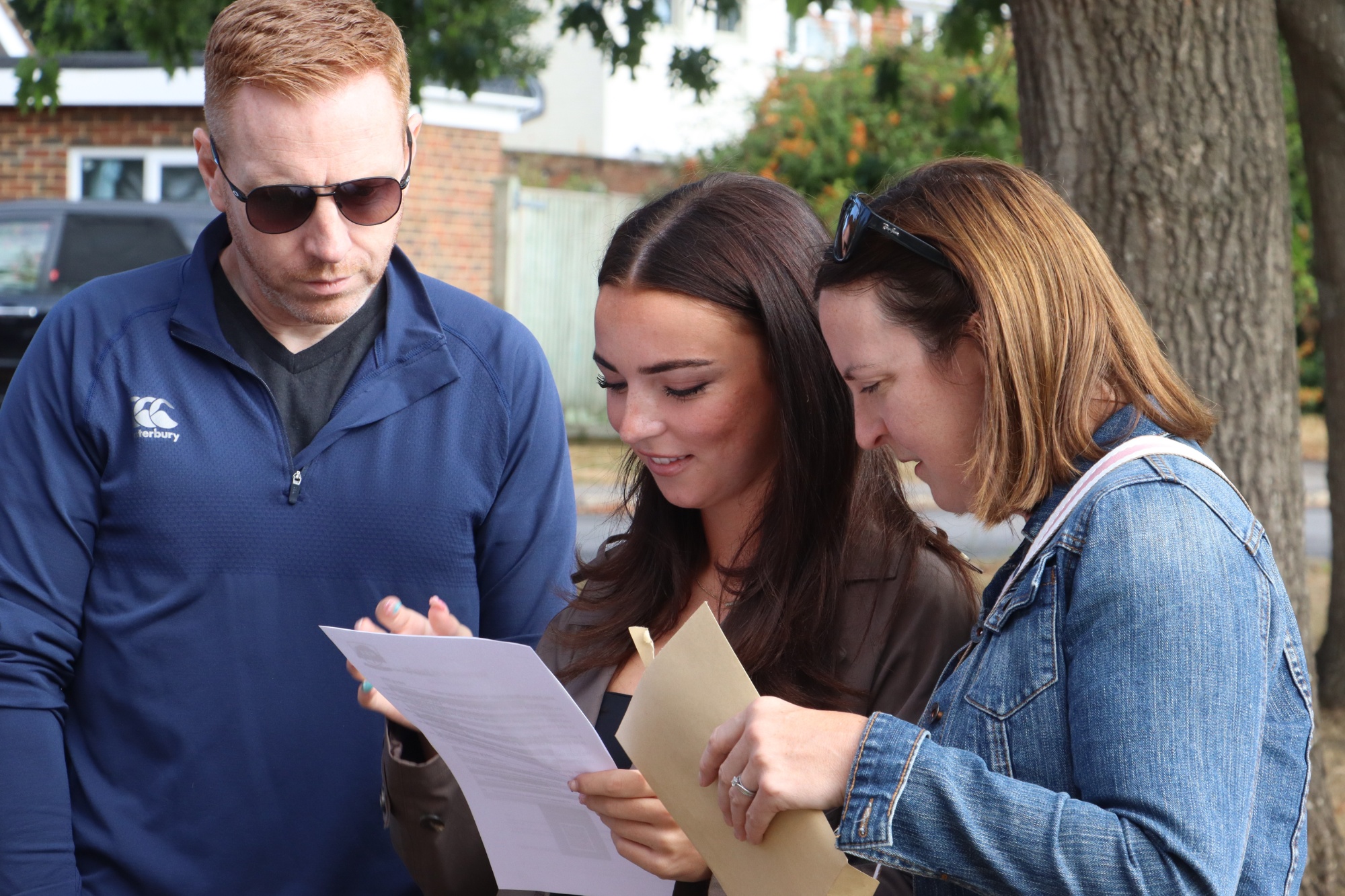 GCSE Student celebrates with family